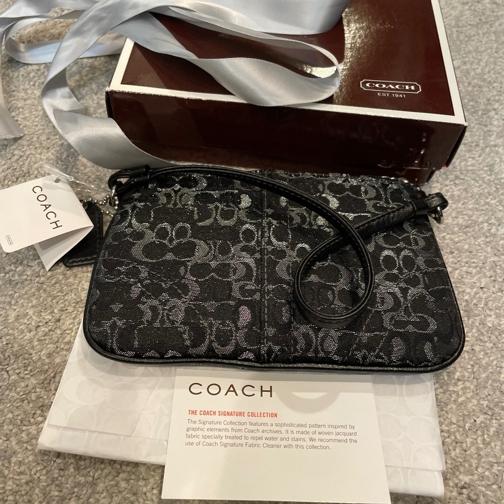 COACH wristlet, black and silver jacquard with "C" logo